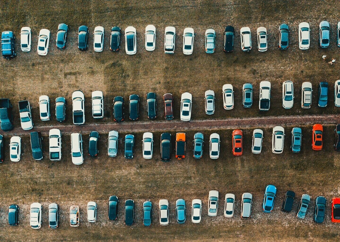 aerial view of cars on park during daytime